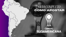 Banner ilustrativo de guia de apostas esportivas focado na Copa Sul-Americana. A imagem é visualmente dividida: o lado esquerdo apresenta um mapa da América do Sul em branco com contornos roxos sobre um fundo roxo vibrante; o lado direito, com um filtro em preto e branco, exibe a verdadeira taça do torneio ao lado do logotipo oficial da Conmebol Sudamericana. Sobreposto a essa área, destaca-se o texto "Guia Completo Como Apostar" em letras brancas. Arte voltada para dicas, tutoriais e mercados de palpites em futebol.